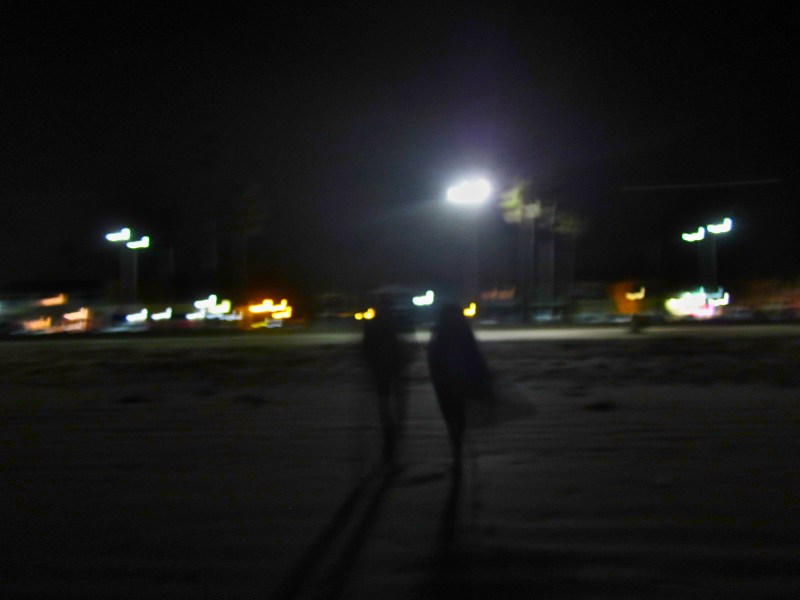 Walking away from the beach at night time